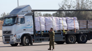 Trucks loaded with humanitarian aid begin entering Gaza through Kerem Shalom border crossing